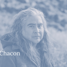 Blue and grey duotone image of the artist Raven Chacon. California Studio logo in lower right and artist's name in lower left